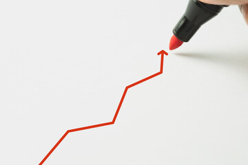 Businessman drawing red arrow up. Businessmen plan the growth. Growth concept.