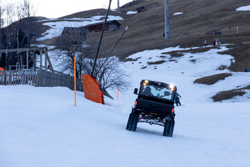 Tracked Utility Vehicle Ascending a Ski Slope