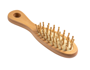 Light-colored wooden hairbrush, oval-shaped head with small, pointed bristles