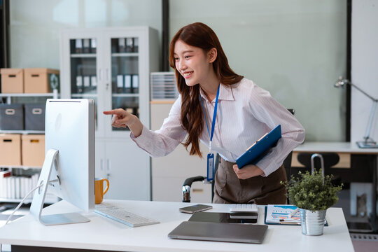 Business concepts, business woman working in the work area with laptop computer and data sheets at the desk.