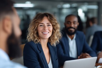 Diverse team collaboration with smiling caucasian female lead in modern office setting