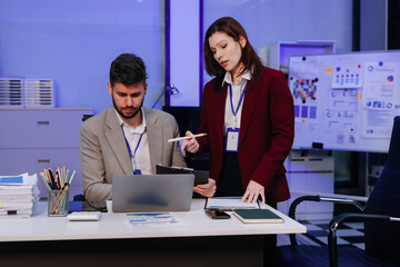 Business team working on a project in the office or reviewing and discussing a business project.