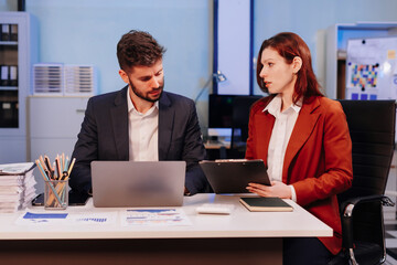 Project manager working overtime and update tasks with milestones progress planning and professional investor working new start up project in the office.