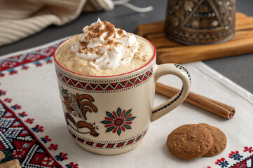 cup of cappuccino with cinnamon and sugar