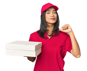 Latina delivering pizza, studio setup feels proud and self confident, example to follow.