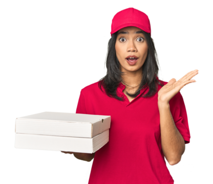 Latina delivering pizza, studio setup surprised and shocked.