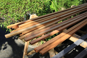 Fototapeta premium Pile of wood is sitting on a table