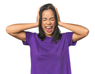 Young Latina posing in studio covering ears with hands trying not to hear too loud sound.