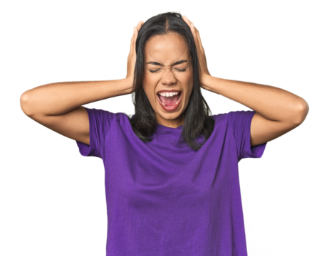 Young Latina posing in studio covering ears with hands trying not to hear too loud sound.