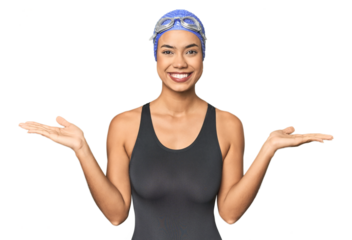 Pro Latina swimmer in studio gear makes scale with arms, feels happy and confident.