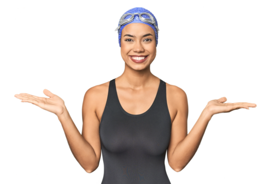 Pro Latina swimmer in studio gear makes scale with arms, feels happy and confident.