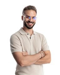 happy young man with glasses smiling, looking forward and crossing arms
