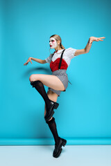 Expressive young woman in striking Halloween costume showcasing unique style during spooky season