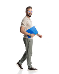 side view of handsome young man with glasses holding clipboard
