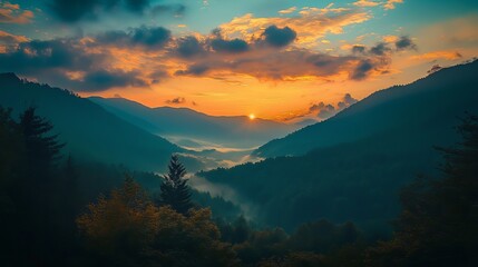 Sunrise over misty mountain valley