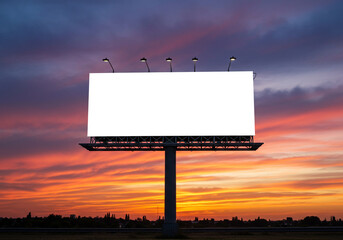 Blank billboard shines brightly against a dramatic sunset, offering a perfect canvas for your impactful marketing messages and brand promotions.
