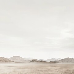 Pale desert landscape.  Vast, beige expanse with muted mountains in the distance