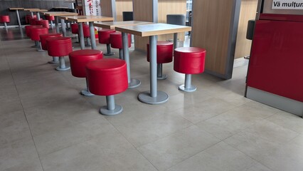 Modern Red Seating Featured in a Chic and Contemporary Dining Area That Invites Gatherings