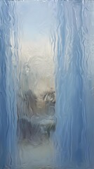 raindrops sliding down glass background blending into soft blue streaks