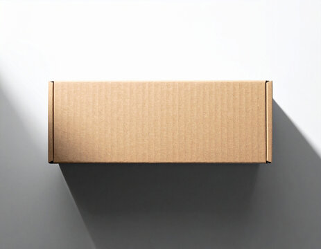 Rectangular corrugated cardboard box with lid, presented from a top-down perspective with soft shadow casting on a neutral background