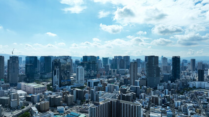 Drone aerial view of modern city and blue sky