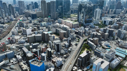 Fototapeta premium Drone aerial view of modern city and roads