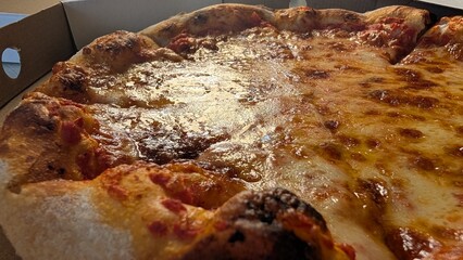 Enjoy a delicious pizza topped with melty cheese and beloved toppings everyone loves