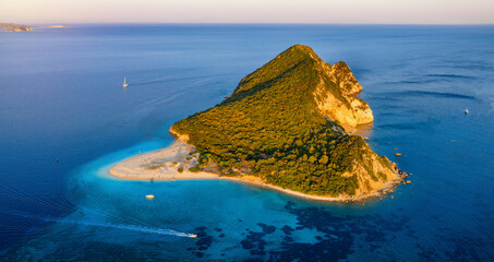 Aerial view of the island of Marathonisi called Turtle island in the bay of Laganas during golden sunset time, Zakynthos, Greece