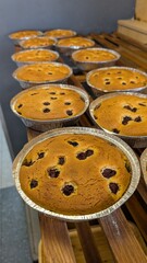 A Varied Array of Delicious Baked Goods Delightfully Displayed on Wooden Shelves