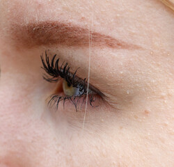 A woman's eye with a black hairline