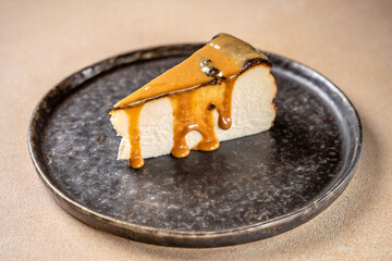 Cheesecake slice with caramel sauce