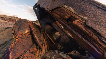 old abandoned sunken ship in the water at the ship cemetery