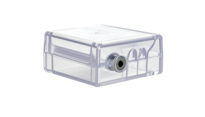 A small clear, rectangular device with a recessed connector and rounded edges