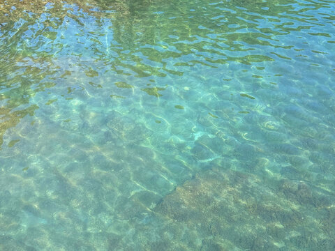 Emerald green sea rippled surface.