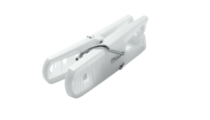 A white, plastic clothes-pegs, open and ready, sits against a black background