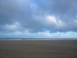 Beach and clouds. Beach in the morning. Nature backdrop. Beautiful natural flyer, card design. Nature Template for presentation or product