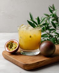 Fototapeta premium Tropical Passionfruit Elixir: A close-up view showcases a vibrant, refreshing passionfruit cocktail, beautifully presented on a wooden board, alongside a selection of fresh ingredients and foliage.