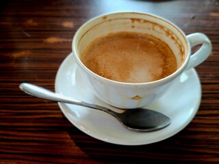 A cup of cappuccino on the table