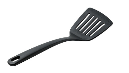 Angled studio shot of a black slotted spatula on black, with handle and hole