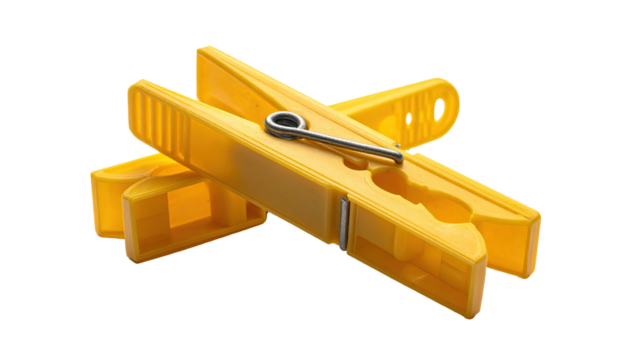 Two yellow plastic fasteners with steel pin, arranged crosswise against black background