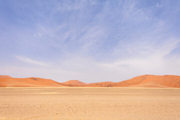 Sossusvlei in Namibia is a desert wonder, famous for its giant red dunes, glowing at sunrise and sunset