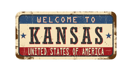 Welcome to Kansas. An old worn sign with an inscription. Welcome metal plaque with rust elements