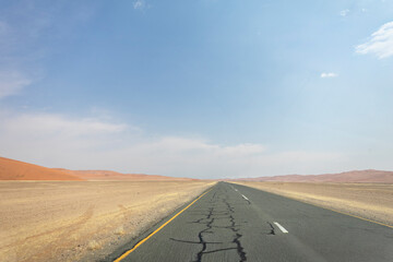 Inside Sossusvlei, gravel roads wind through red dunes to Deadvlei, Big Daddy, and Sesriem Canyon, Namibia