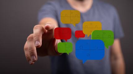 Concept showing team communication integration symbolized by jigsaw puzzle speech bubbles, highlighting collaborative thinking and diverse persp