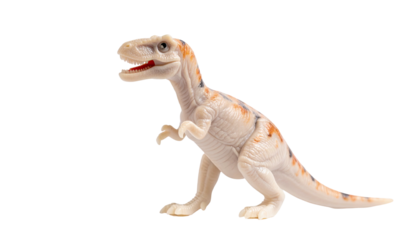 Small, off-white toy dinosaur with orange markings, standing against a black backdrop