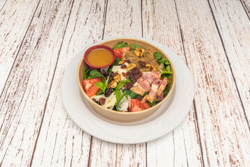 A fresh salad with ripe vine tomatoes, finely chopped shallots, and crisp romaine lettuce, dressed with light olive oi