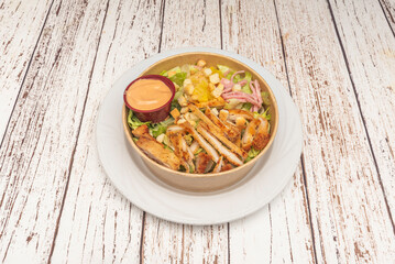 Honey mustard chicken salad, where grilled chicken breasts are tossed with lamb's lettuce and arugula, creating a perfect balance of sweet and spicy