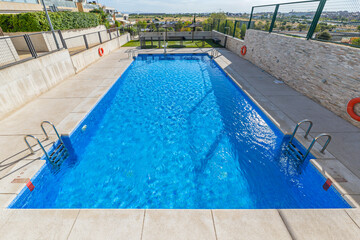 Obraz premium Pool complex with towel service, premium sun loungers, and designer umbrellas