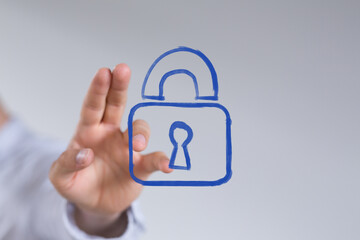 A hand interacts with a glowing blue digital padlock icon, symbolizing advanced cybersecurity, data protection, and online privacy solutions.