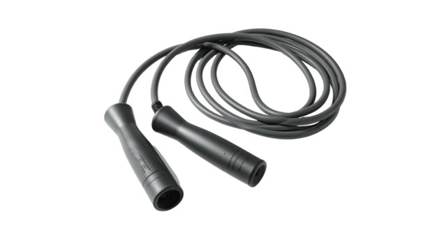 Black jump rope lies coiled against a black background, handles and cord visible